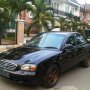 DIJUAL SUZUKI BALENO HITAM MANUAL 2002 DP RINGAN