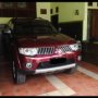 Jual Pajero Sport 2.5 exceed 4x2 Diesel A/T Merah Tua